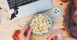 watching laptop with a bowl of popcorn